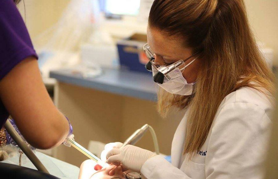 Dentist treating dental patient