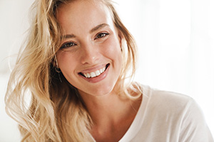 Closeup of woman in white shirt smiling