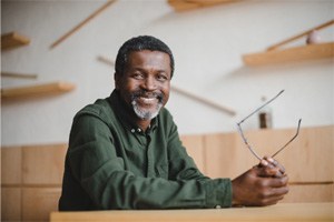 man smiling after getting dentures