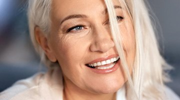 woman smiling while outside