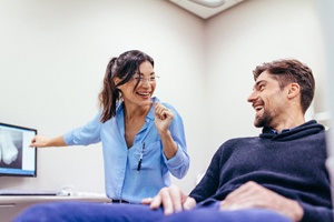 dentist showing a patient their X-rays