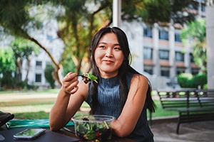 Patient in Springfield eating with dental implants