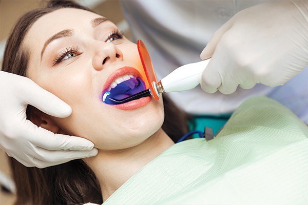 Woman having teeth cleaned