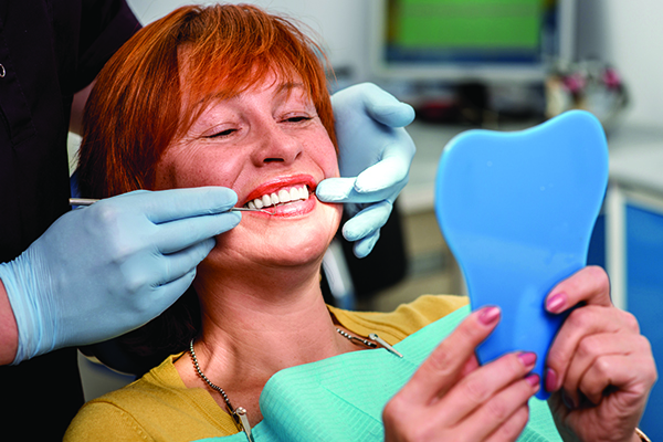 woman smiling in dental chair