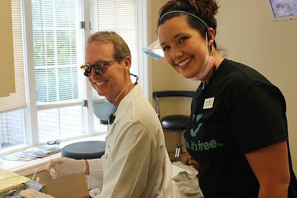 dentist with staff