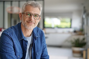Close-up of man in denim jacket smiling