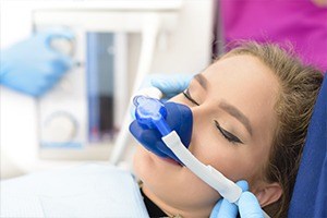 Woman with nitrous oxide mask