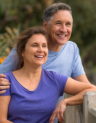 Smiling older man and woman outdoors