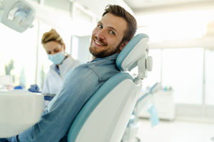 Man smiling while relaxing in treatment chair