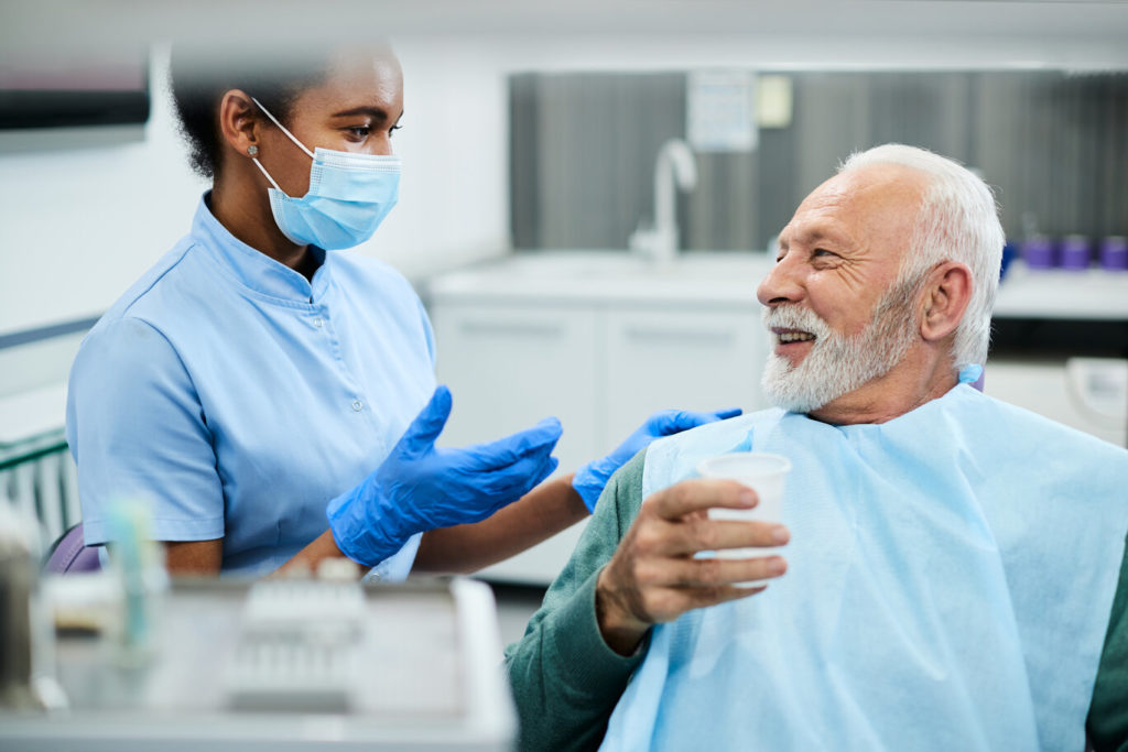 person learning about benefits of sedation dentistry in Springfield