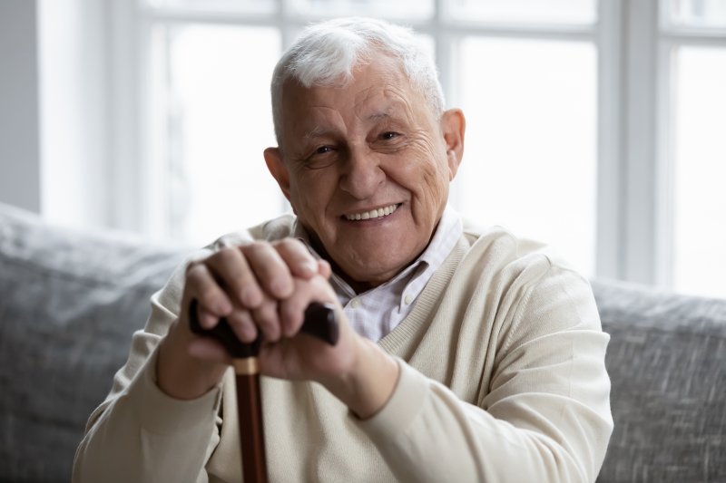 Smiling elderly person with rheumatoid arthritis