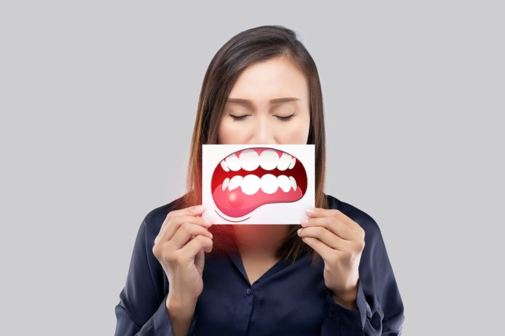 A woman holding a gum disease drawing